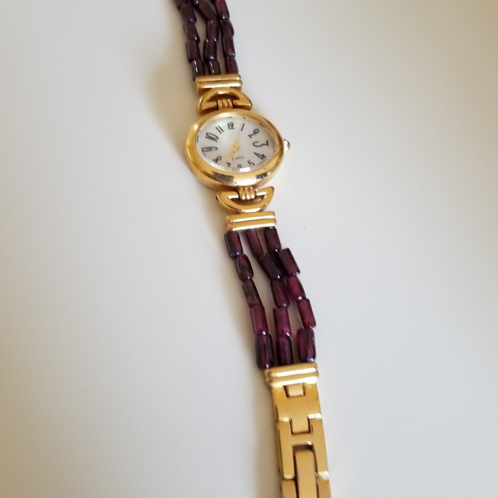 Goldtone and garnet bead watch
